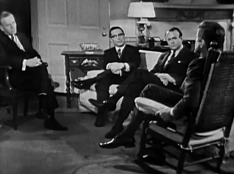 A wide shot of the Oval Office interview in progress, with President Kennedy and the three White House correspondents, in a public-domain still from the 1962 After Two Years broadcast
