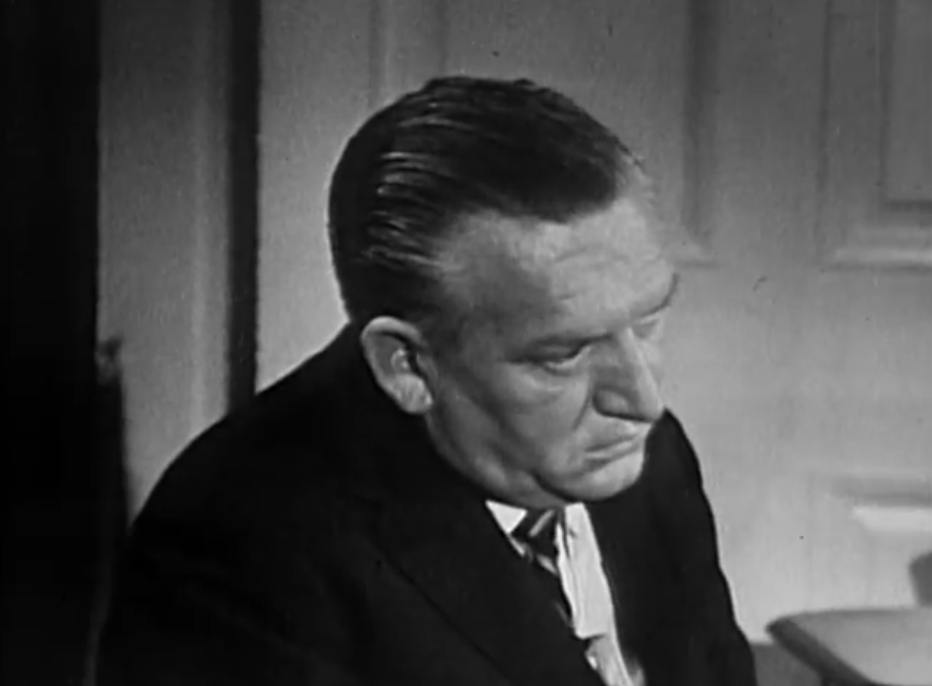 ABC News correspondent Bill Lawrence taking notes during the 1962 After Two Years interview, in a public-domain still from the original broadcast